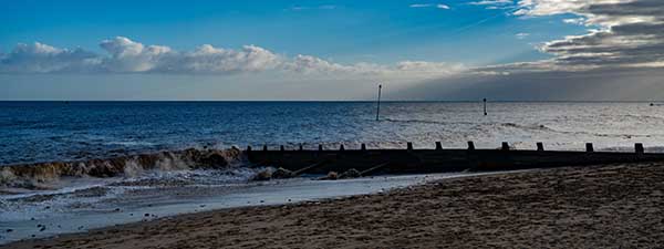 Waves crashing on a deserted beach